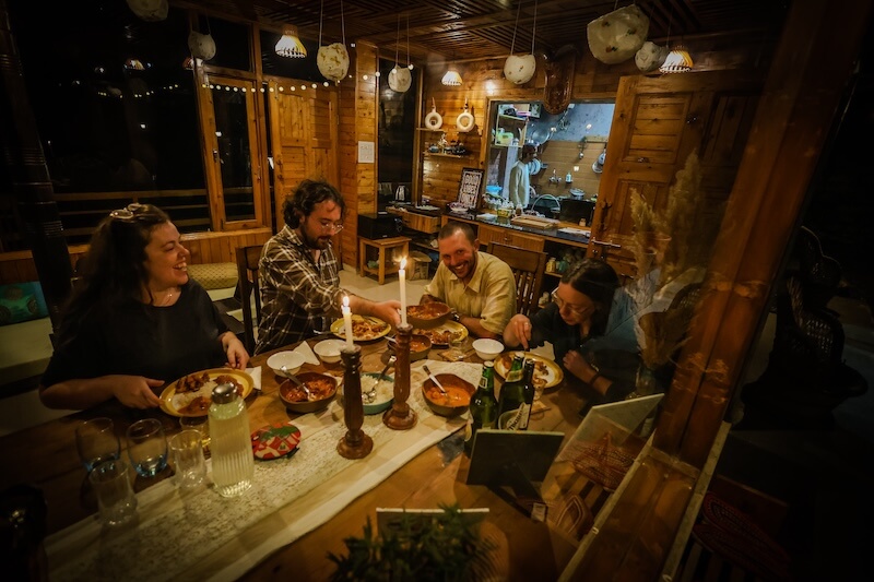 The Lazy and Slow dining area - Cozy wood and glass dining hall with lounge seating