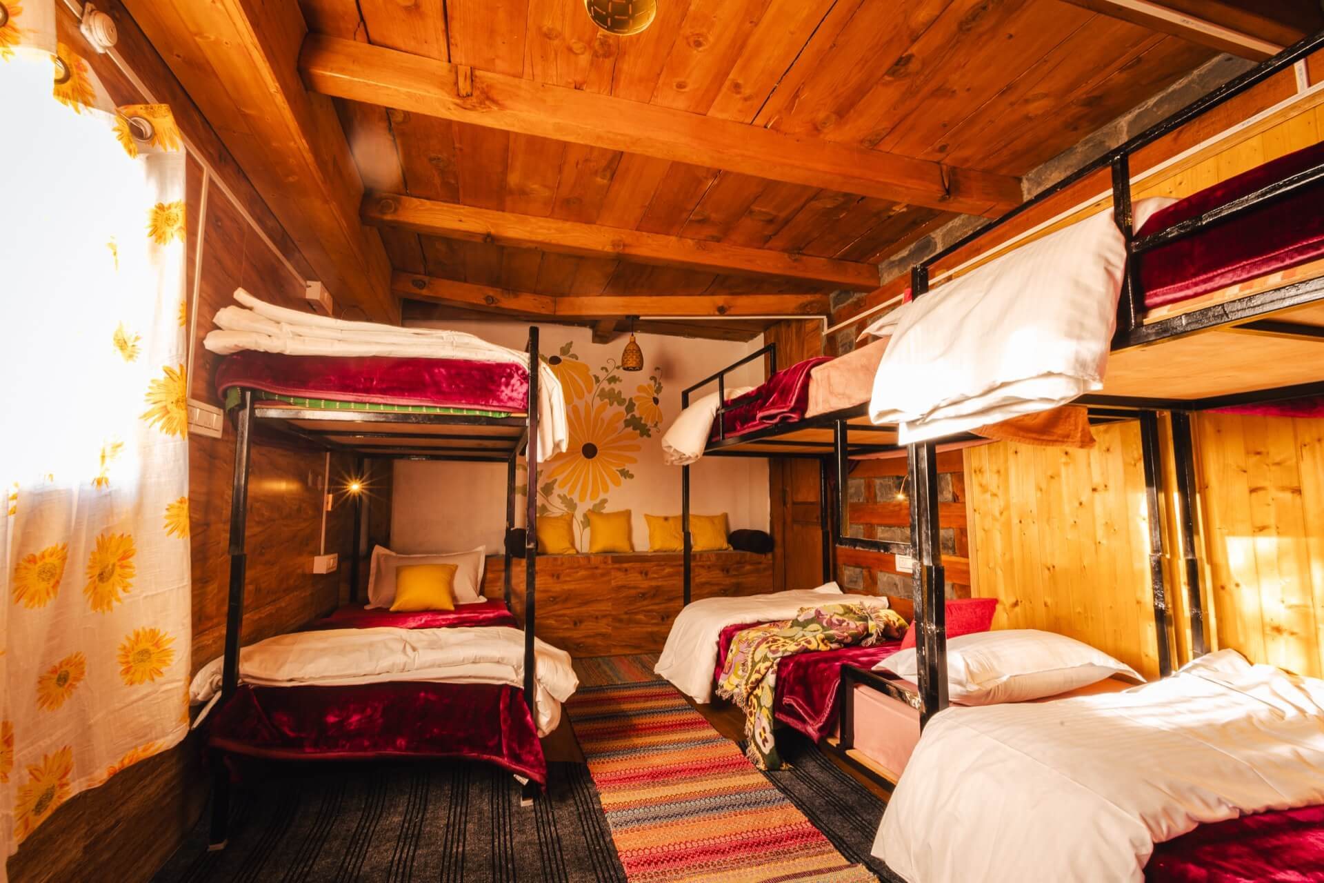 Sunflower Dorm — bunk beds in a timber room